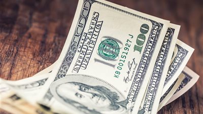 استقرار الدولار بفعل آمال محادثات التجارة